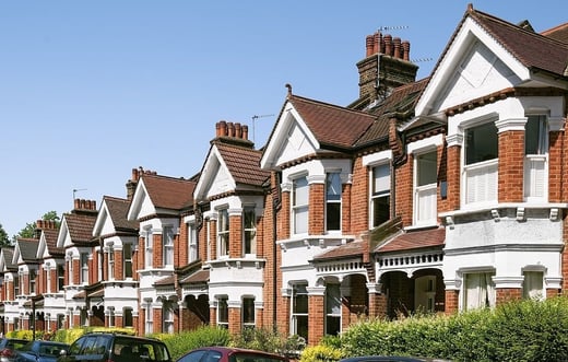 A row of well-maintained suburban homes, representing residential property markets and community investment opportunities.