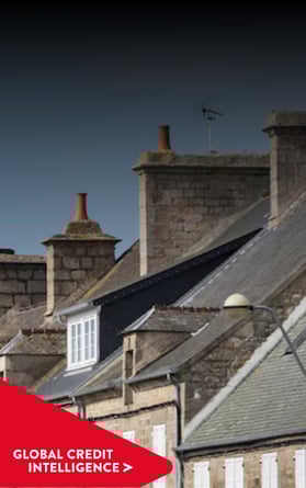 Row of stone buildings symbolizing financial stability, credit intelligence, and trusted risk management solutions with a red banner overlay reading 'Global Credit Intelligence.