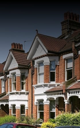 A row of well-maintained suburban homes, representing residential property markets and community investment opportunities.