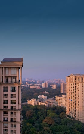 Residential towers stand above other residential buildings in the Powai suburb of Mumbai, India.