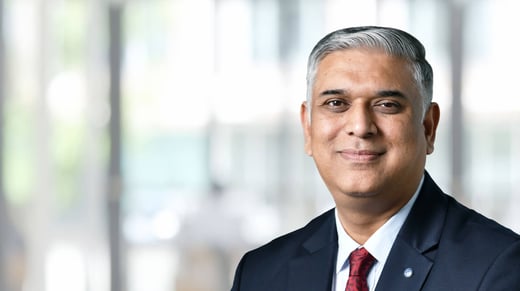 Mukund Kulkarni in front of a blurred office background