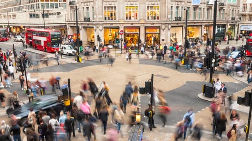 Blurred people crossing the bustling Oxford Circus crossing, London