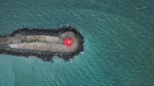 Aerial view of Poolbeg Lighthouse, the red lighthouse in Dublin, Ireland