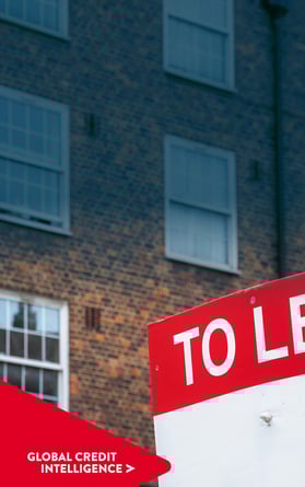 To let sign in front of a dark brown and orange brick building. Global Credit Intelligence chevron point overlaid bottom left hand corner.