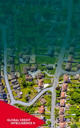 Aerial view of a residential neighbourhood in the UK. Global Credit Intelligence chevron point overlaid bottom left hand corner