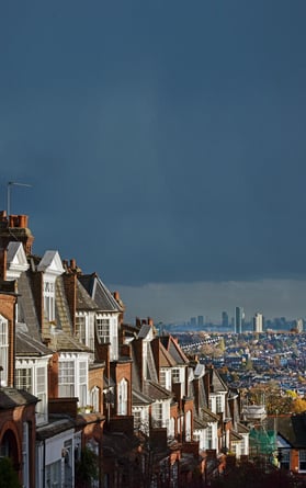 UK residential property with city backdrop and gloomy sky