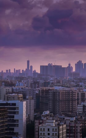 rooftop view of Indian city under violet cloudy sky