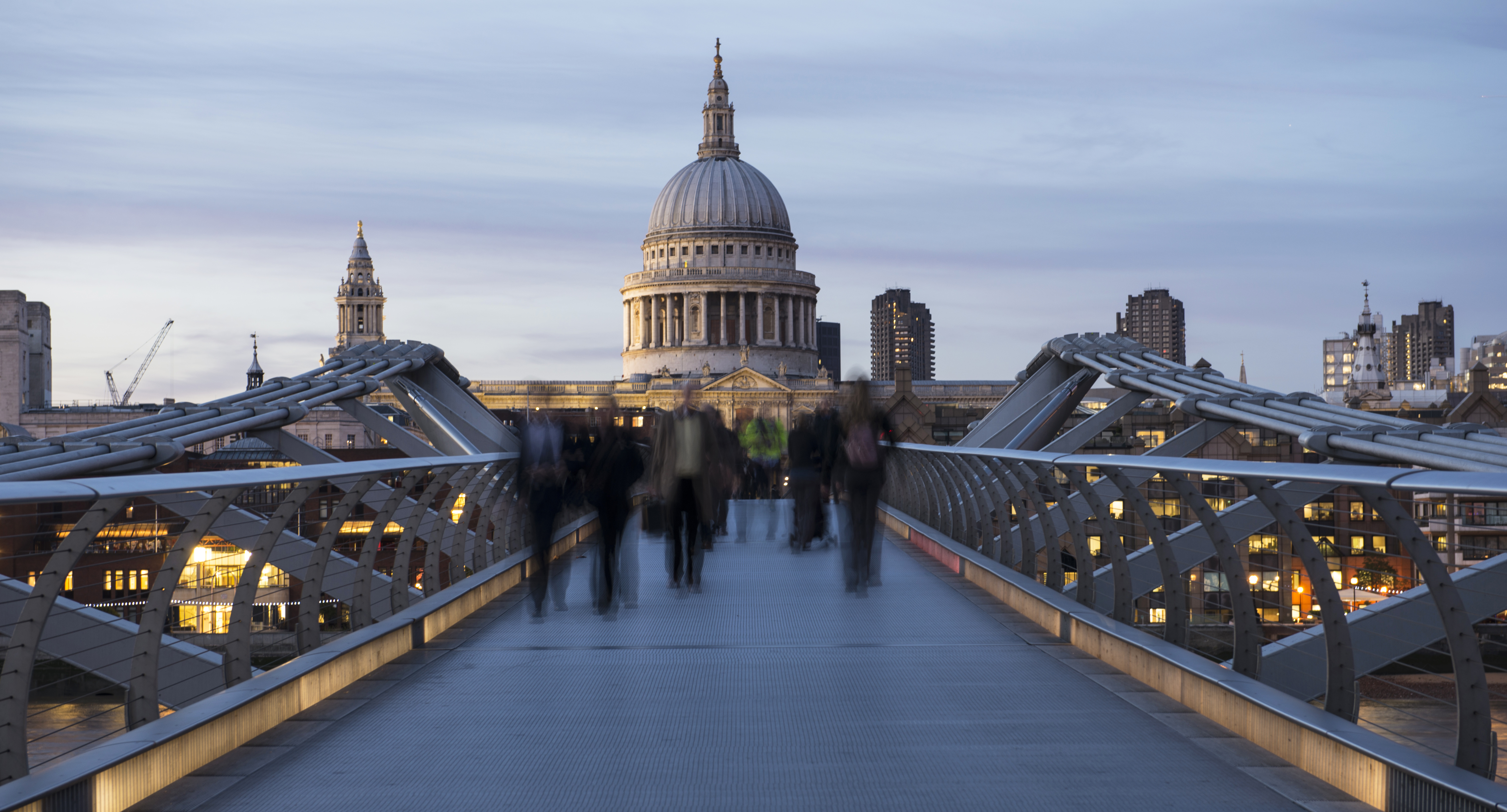 Office workers head home Millennium Bridge, London