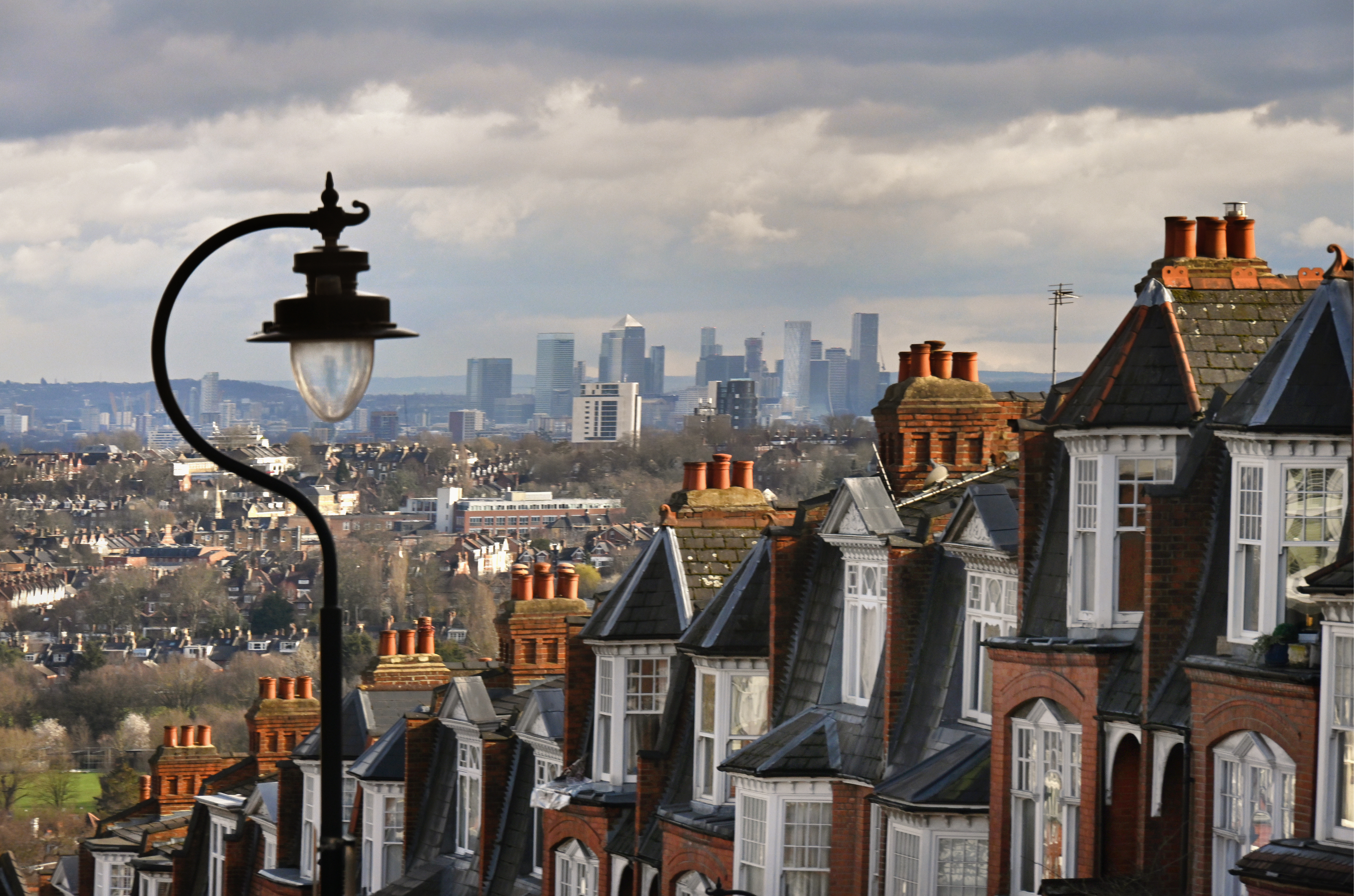 UK residential property with city backdrop and gloomy sky