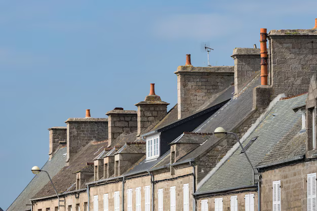Row of stone buildings symbolizing financial stability, credit intelligence, and trusted risk management solutions.