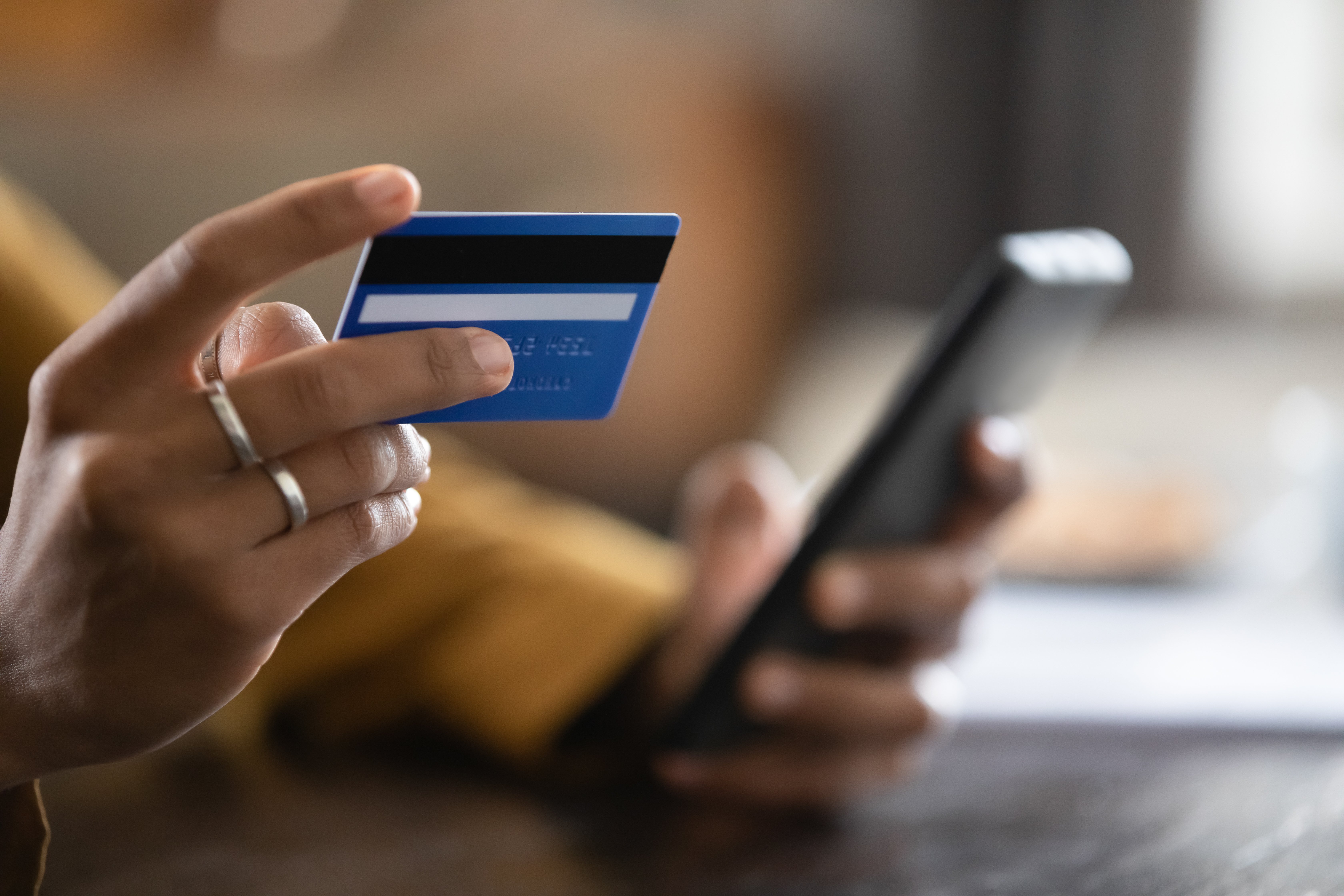 Close up of woman shopping use credit card and smartphone