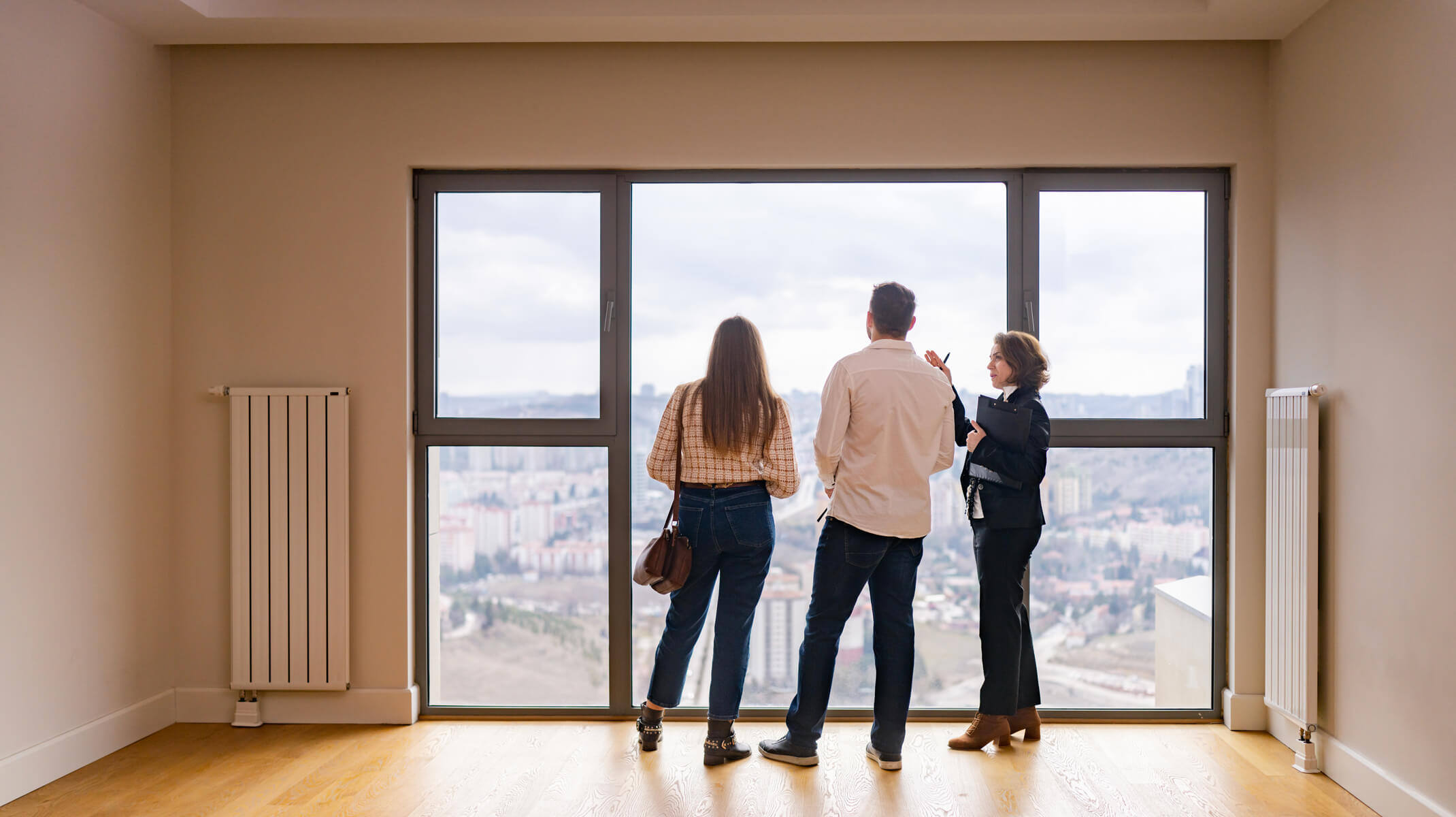 Realtor shows couple the view around a potential home.