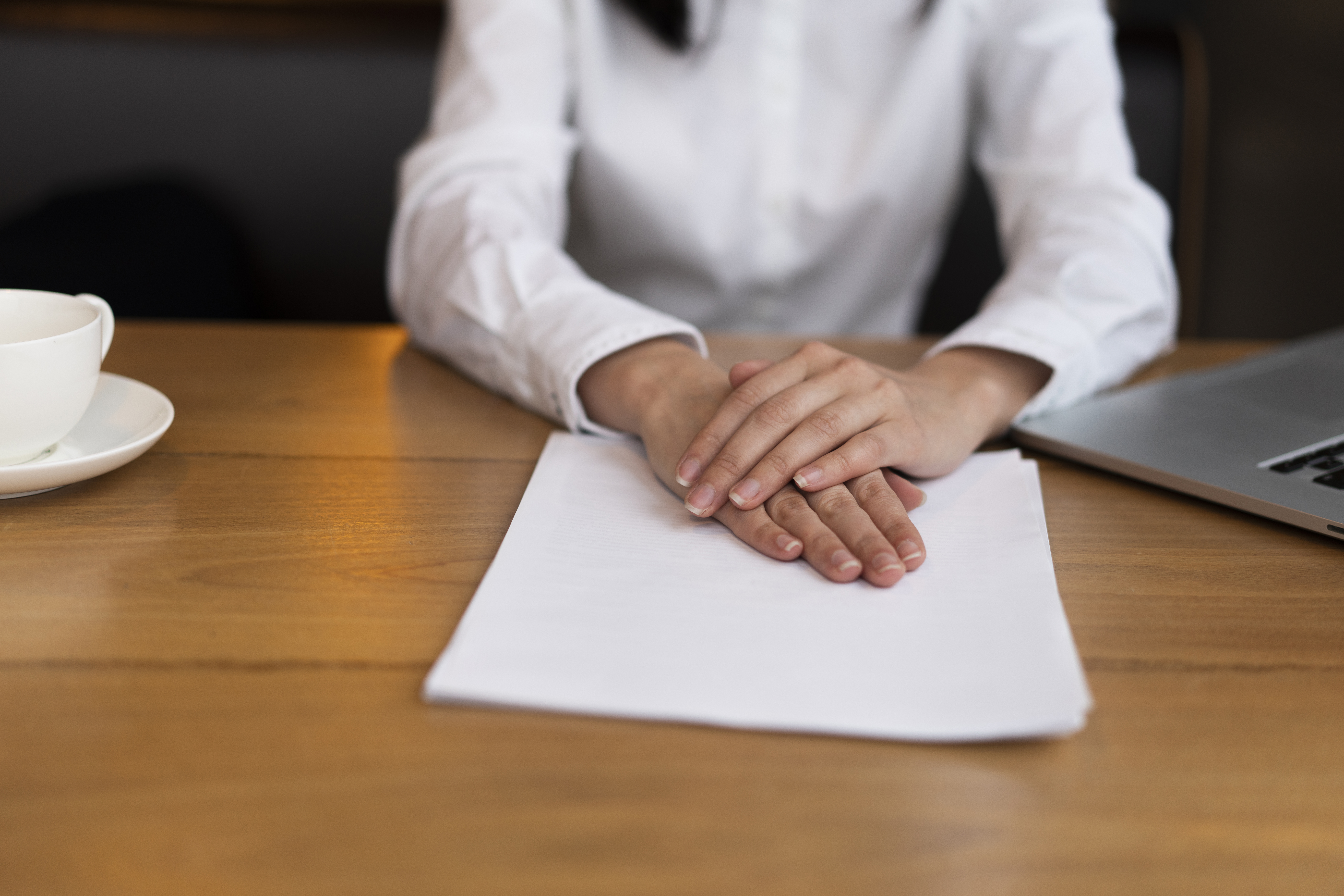 close-up-customer-holding-hands-papers